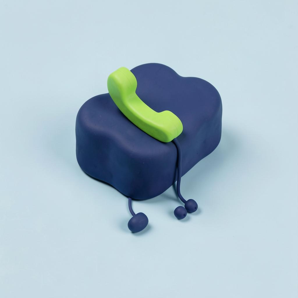 Clay-style illustration of a navy cloud with a green handset resting on it